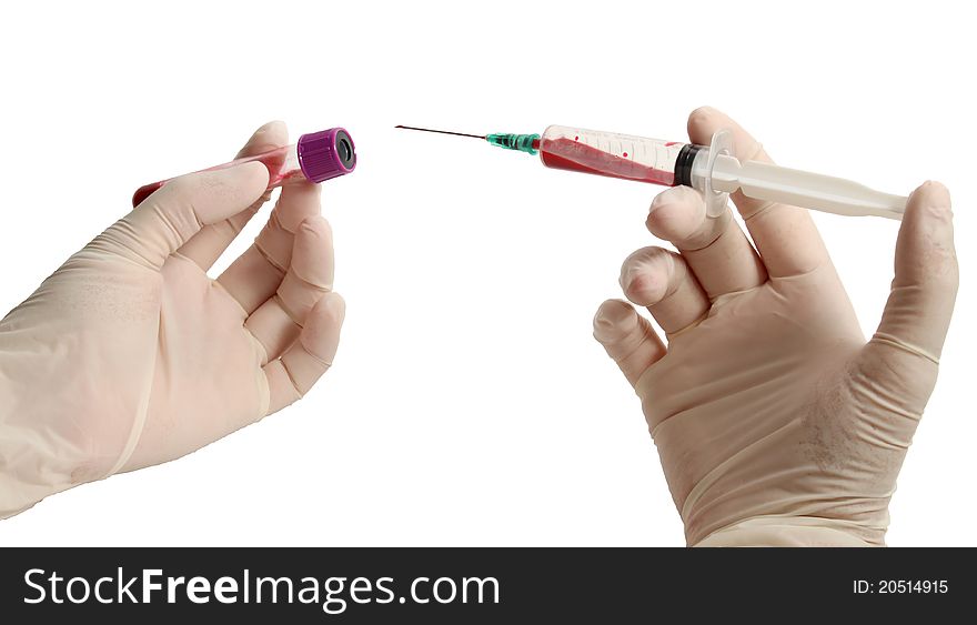 Hands in gloves holding syringe and blood container isolated on white with clipping path. Hands in gloves holding syringe and blood container isolated on white with clipping path.