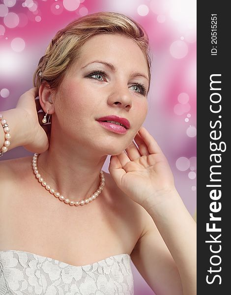 Beautiful romantic woman in the pearl necklace