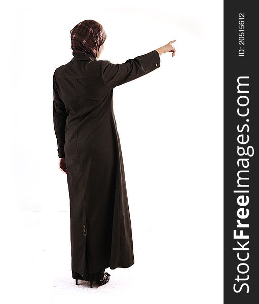 Muslim girl pointing on white background