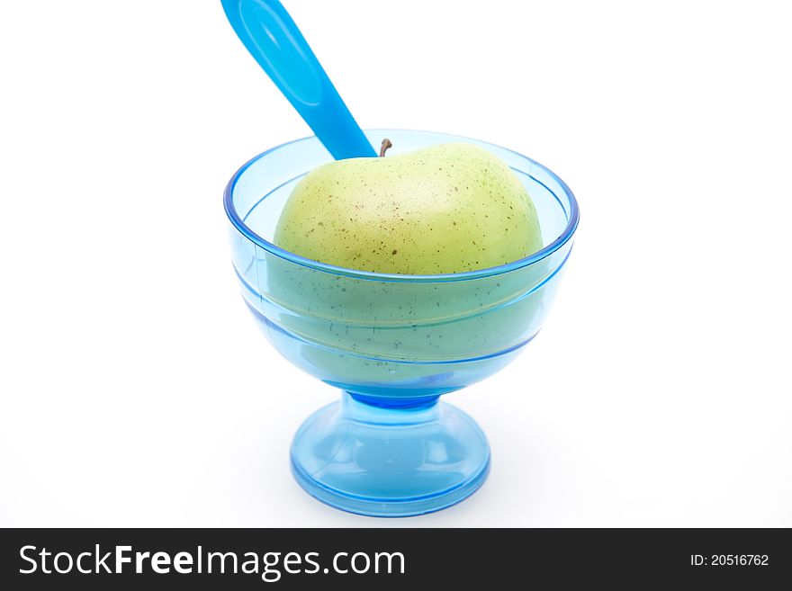 Blue ice cup with spoon and apple. Blue ice cup with spoon and apple