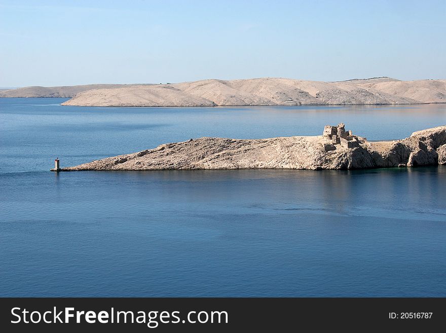 Lighthouse and the ruins of the far south point of the island Pag in Croatia