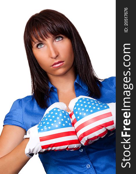 Confident businesswoman preparing to fight with boxing gloves on a white background. Confident businesswoman preparing to fight with boxing gloves on a white background