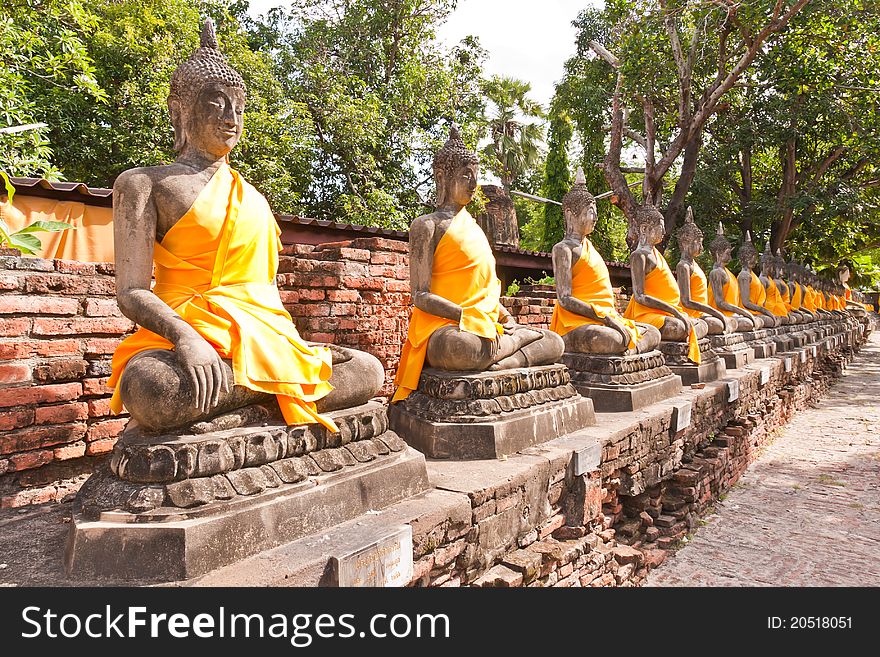 Ruin Buddha statues in row from side seamless