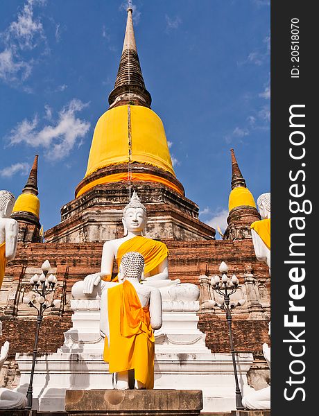 Buddha statues in front of ruin pagodas in Ayutthaya Thailand with blue sky. Buddha statues in front of ruin pagodas in Ayutthaya Thailand with blue sky