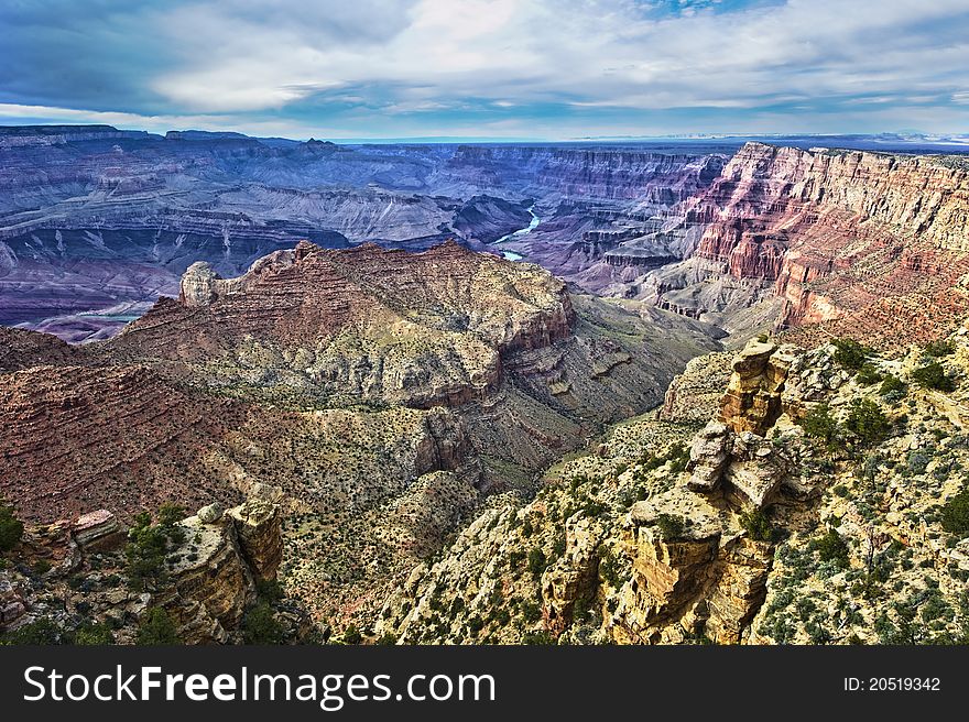 Grand Canyon from the top with blue sky and clouds