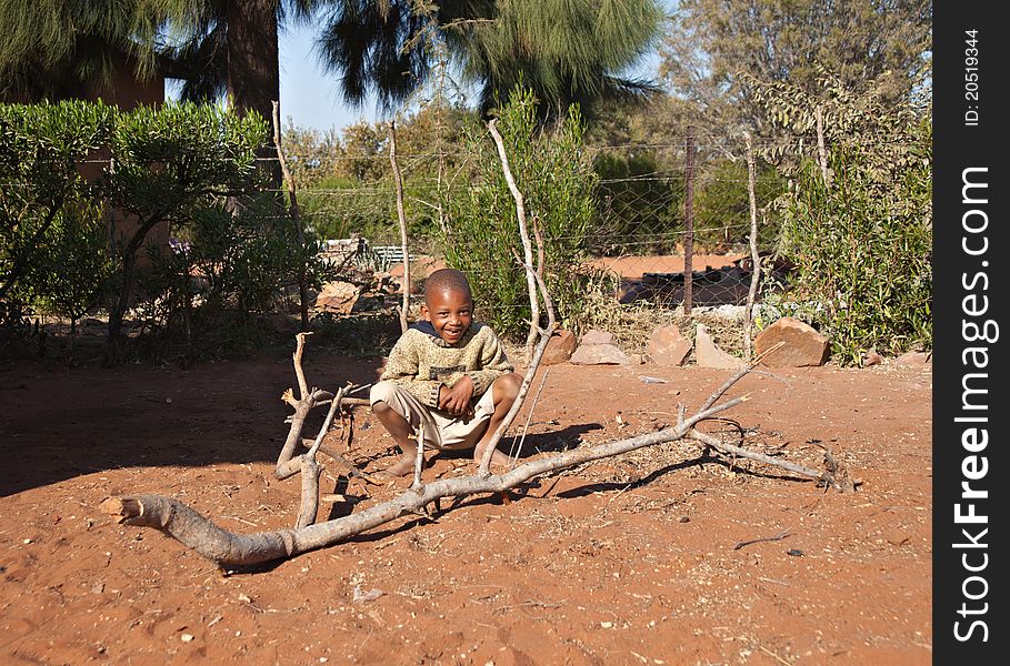 Poor African little boy playing, Mochudi village, Botswana