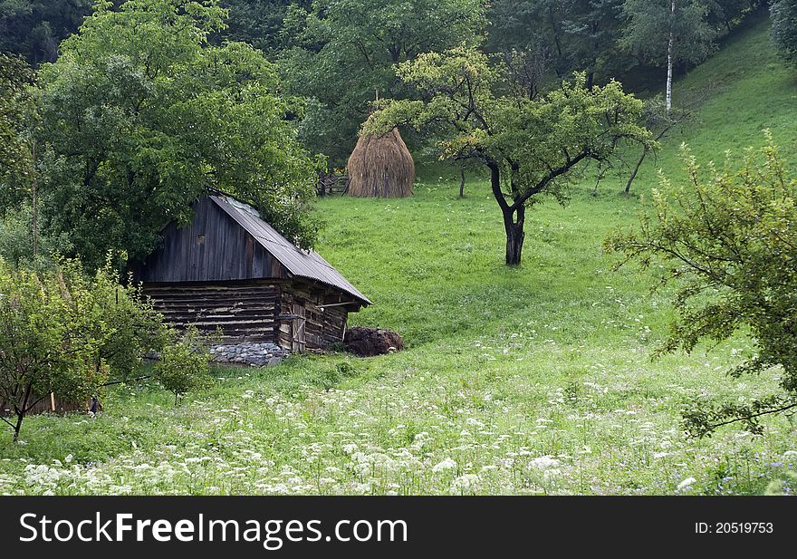 Old barn and haystack down the hill, raw. Old barn and haystack down the hill, raw