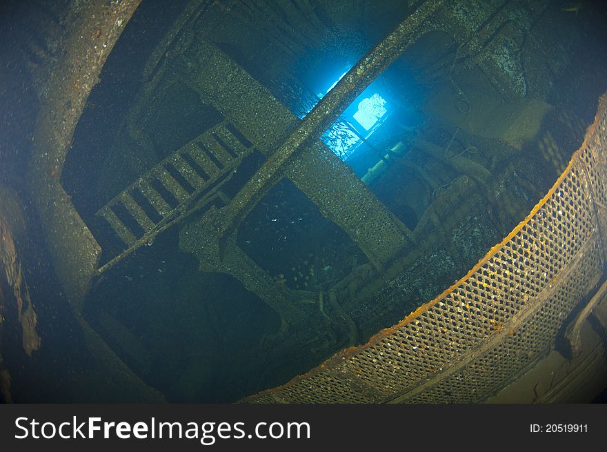 Deep inside the engine of a large underwater shipwreck. Deep inside the engine of a large underwater shipwreck