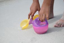 Holding Toys On Beach Royalty Free Stock Images