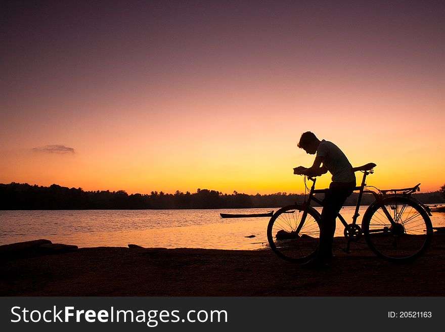 Thinking biker against a sunset. Thinking biker against a sunset