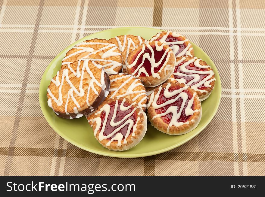 Cookies with strawberry jam on a plate