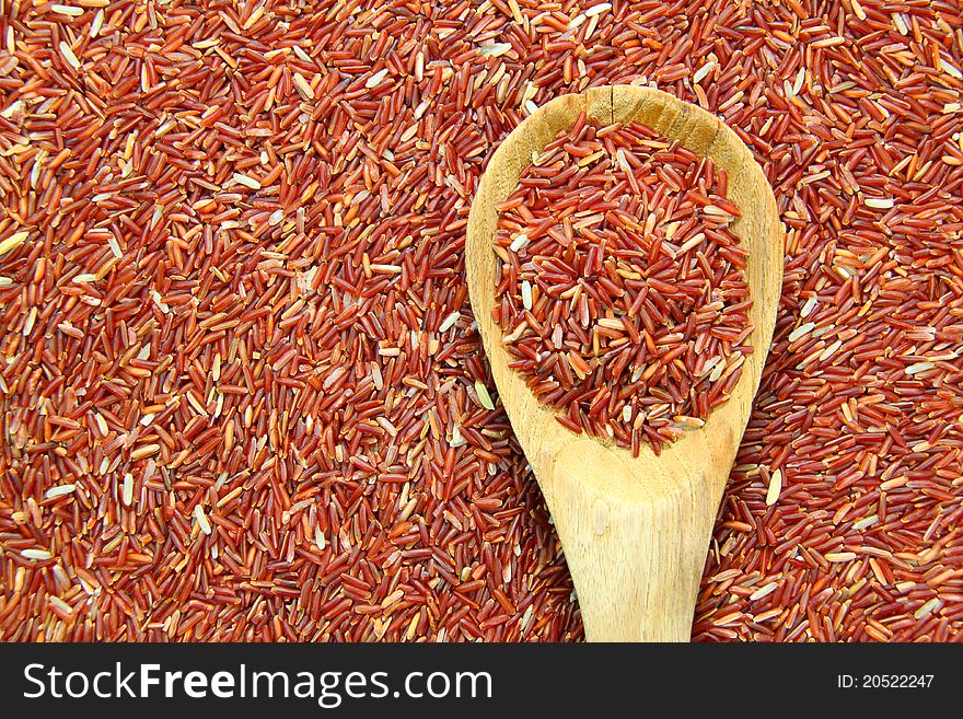 Red Jasmine Rice And Ladle On rice background