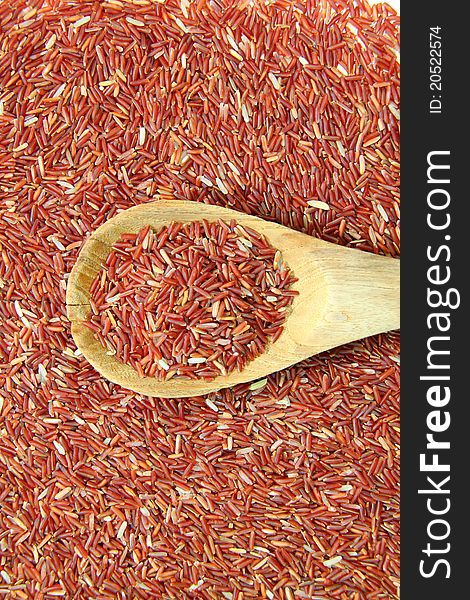 Red Jasmine Rice And Ladle On rice  background