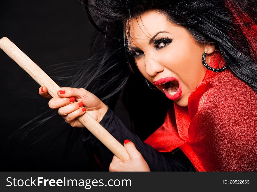 Female witch with broomstick, looking scary and screaming. Female witch with broomstick, looking scary and screaming