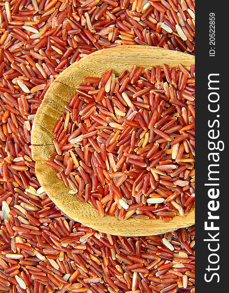 Red Jasmine Rice And Ladle On rice background