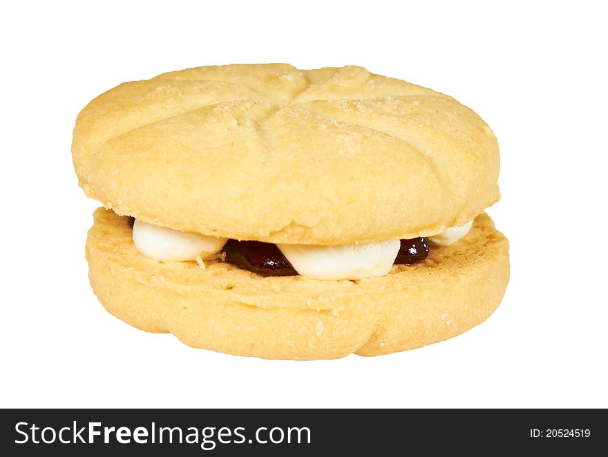 A cookie sandwich with jam and cream in the middle, isolated on white. A cookie sandwich with jam and cream in the middle, isolated on white.