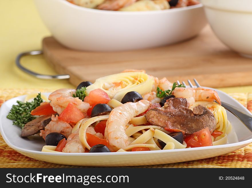 Shrimp with fettuccine noodles on a plate. Shrimp with fettuccine noodles on a plate