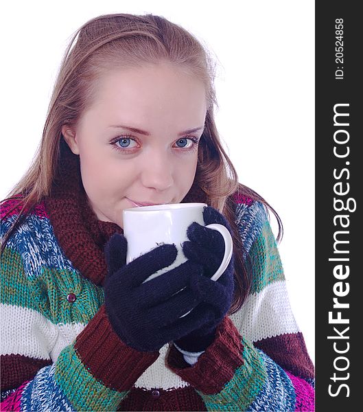 Girl in winter clothes with cup of coffee on white. Girl in winter clothes with cup of coffee on white