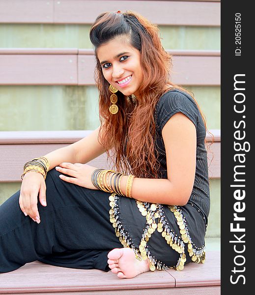 Pakistani model posing with traditional gold ornaments