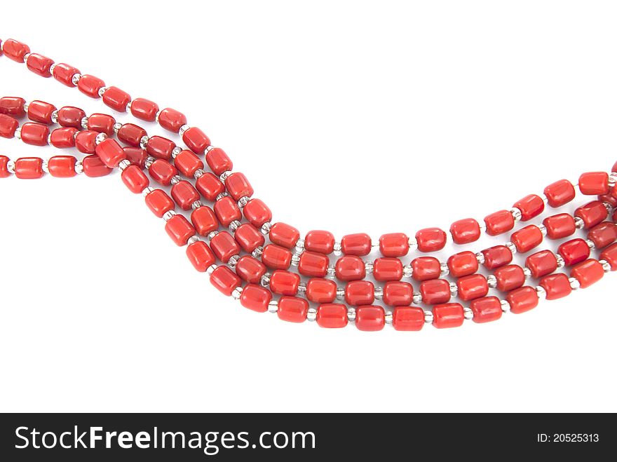 Four rows of bright plastic necklace on white background
