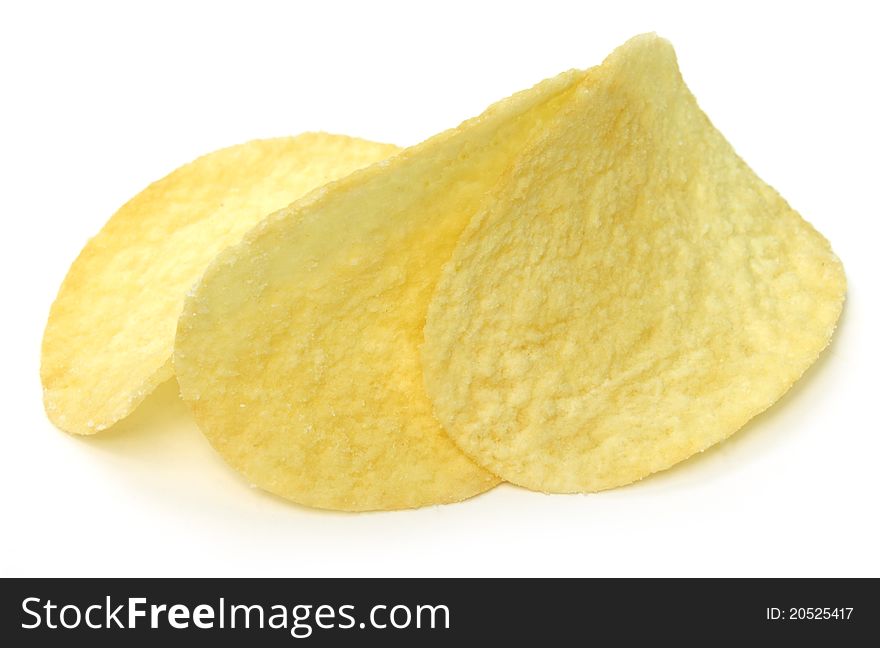 Crispy potato chips over white background