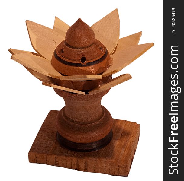 A flower shaped wooden stand used to hold incense stick sticks. A flower shaped wooden stand used to hold incense stick sticks.