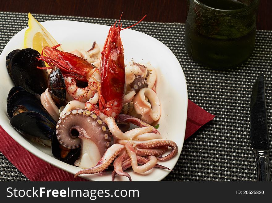 Fresh seafood salad with mussels, octopus and shrimp