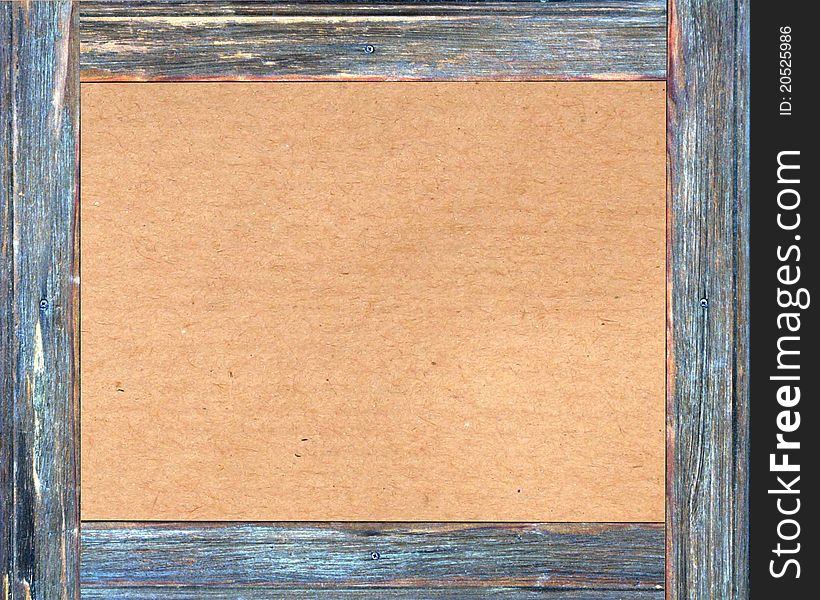 Brown cardboard in a wooden frame with space for your design. Brown cardboard in a wooden frame with space for your design