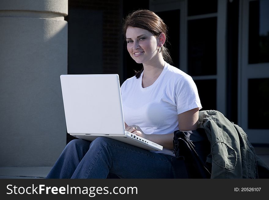 Female Student With Laptop Computer