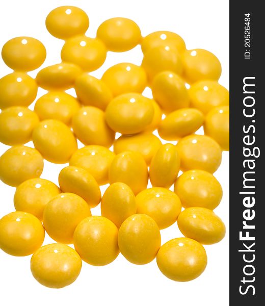 Many yellow vitamin drug close up