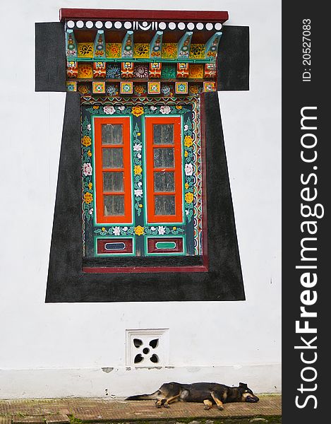 Old-styled wooden decorated Tibetan window. Sikkim. India. Old-styled wooden decorated Tibetan window. Sikkim. India