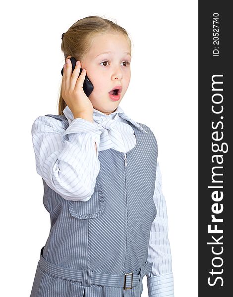 The beautiful girl with astonishment speaks on the phone. The beautiful girl with astonishment speaks on the phone