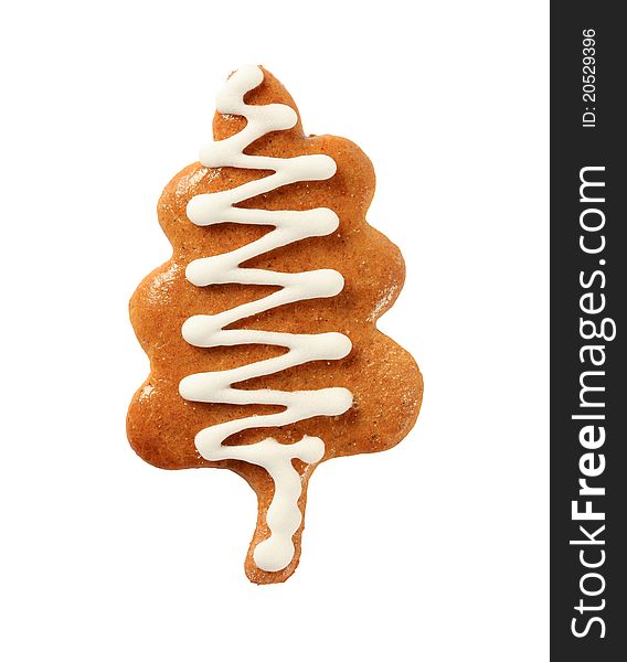 Gingerbread cookie in the shape of tree - cut out on white