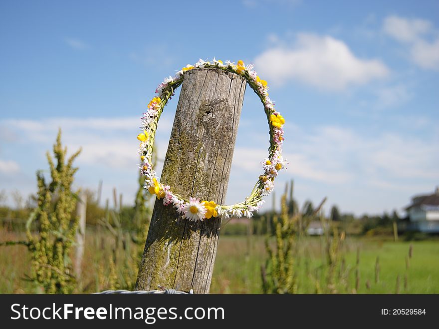 Flower garland hanging on fence