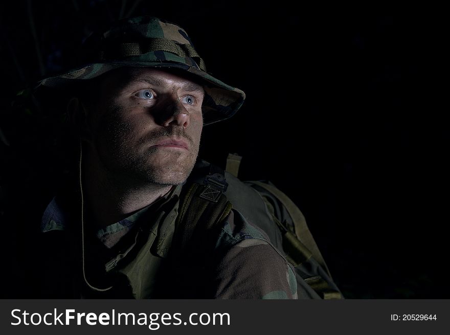 Man wearing camouflage uniform and rifle. Man wearing camouflage uniform and rifle