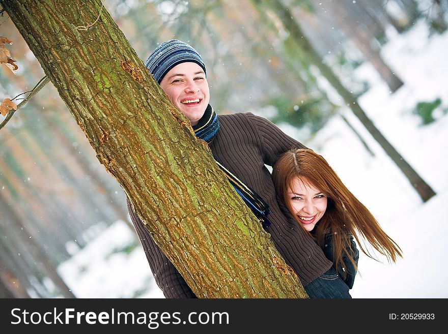 Young couple in love smiling in winter. Young couple in love smiling in winter