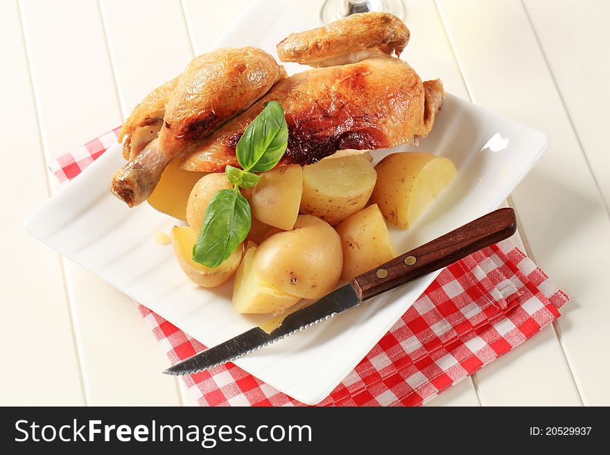 Roast chicken and new potatoes - still life. Roast chicken and new potatoes - still life