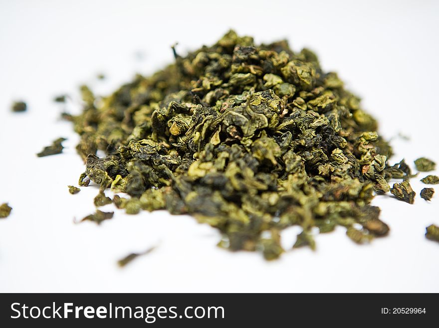 Green tea leaves on a white background