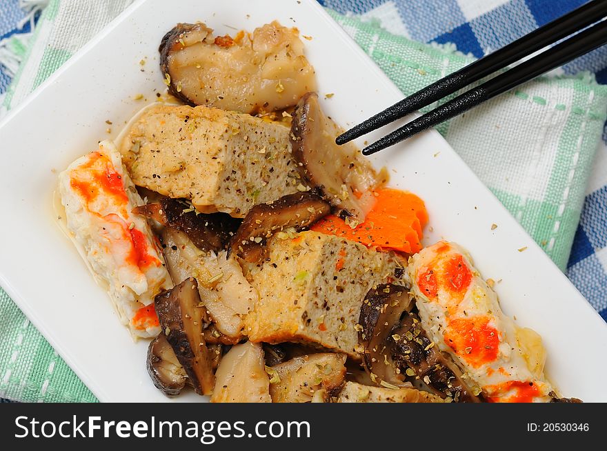 Oriental style prawn and tofu dish on white plate. Oriental style prawn and tofu dish on white plate.