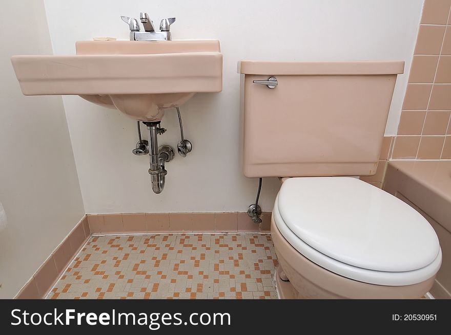 Generic beige color toilet and hand wash basin. Generic beige color toilet and hand wash basin.