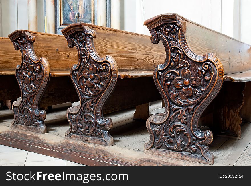 Detailed view of an old wooden church pews.