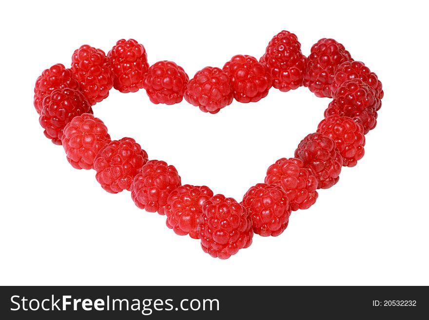 Heart made of raspberries isolated over white background
