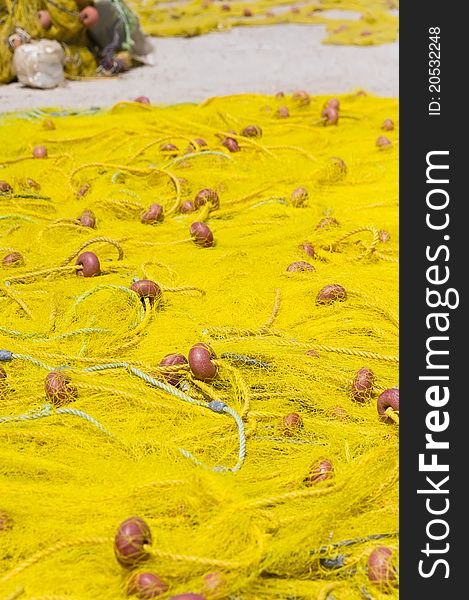 Yellow fishing nets stretched in the sun