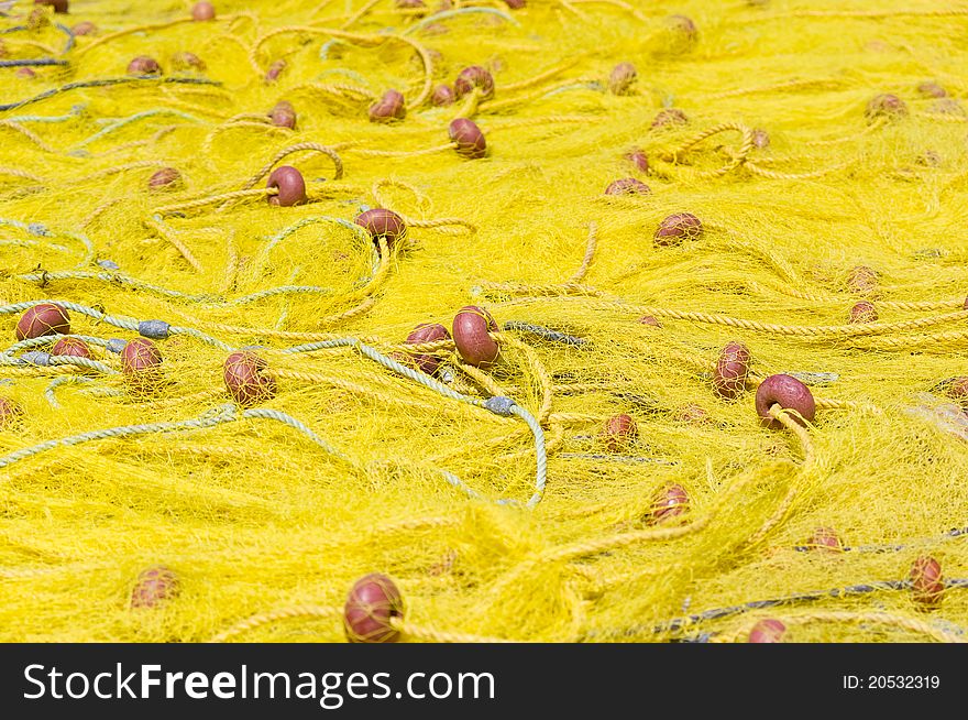 Yellow fishing nets stretched in the sun