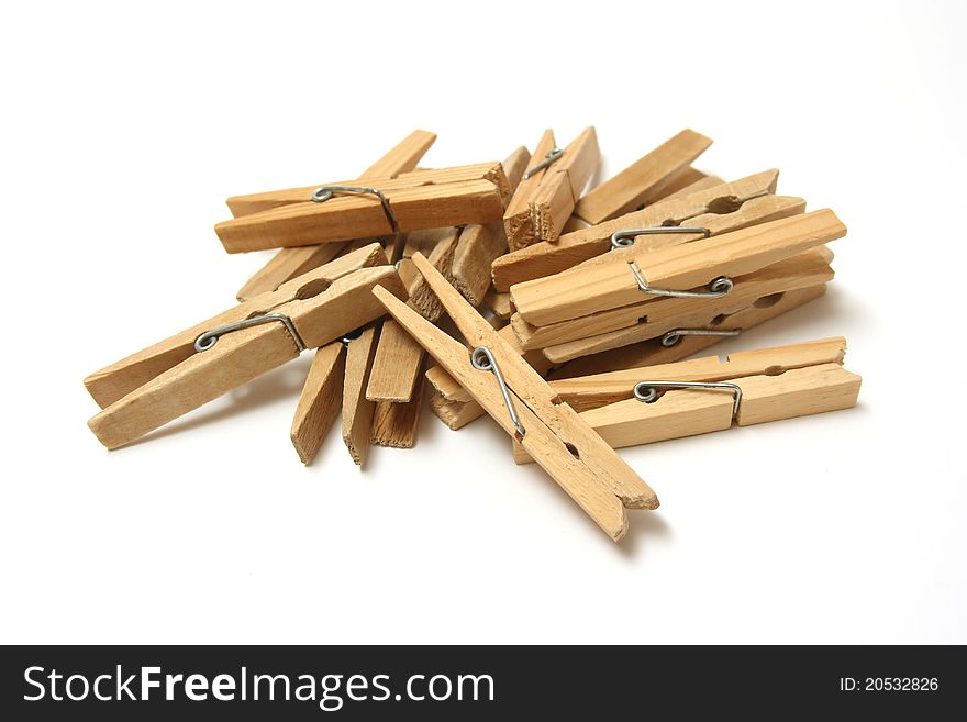 Wooden pegs on a white background