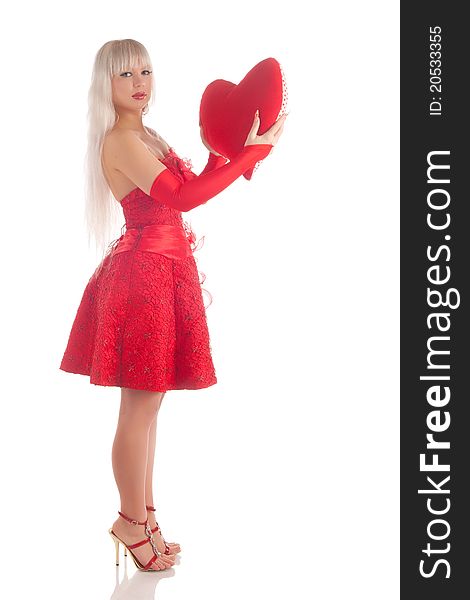 Glamour girl in a red dress with a gift in a hand