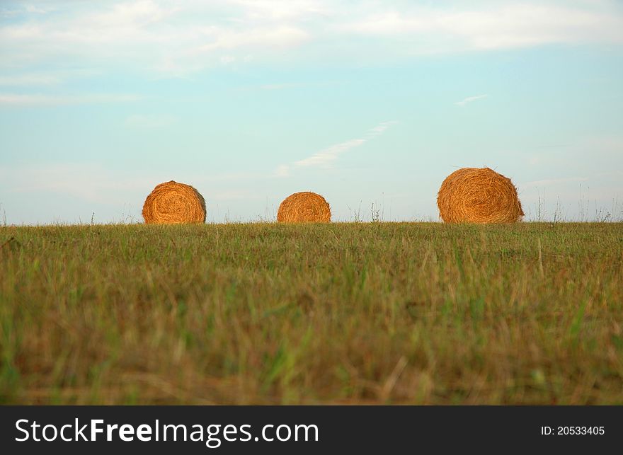 Three Haystacks on the green field