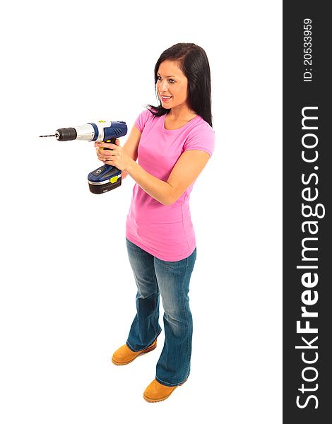 Young female dressed in pink top and blue jeans holding a cordless electric drill on isolated white background. Young female dressed in pink top and blue jeans holding a cordless electric drill on isolated white background.