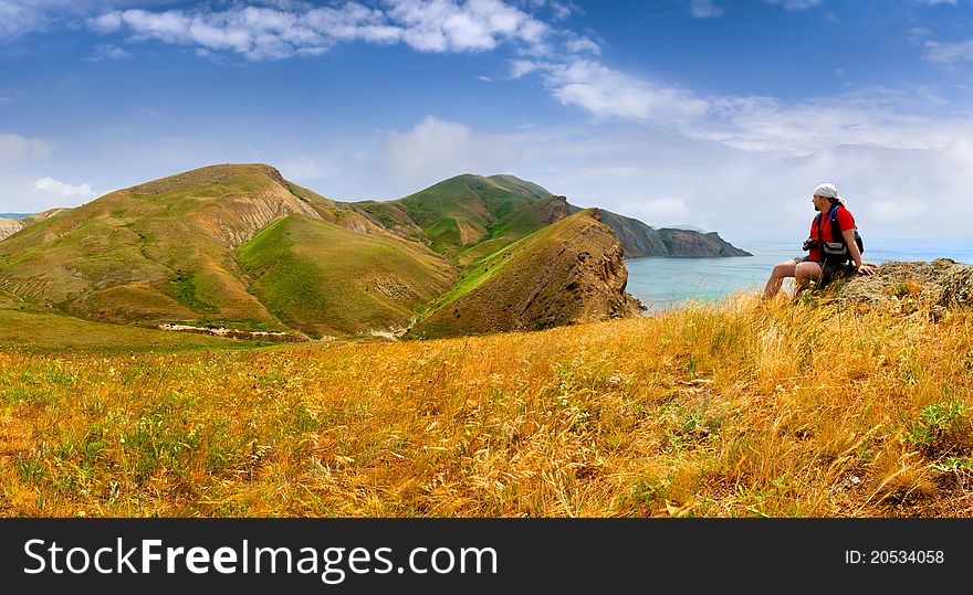 Man admiring of mountain landscape near the sea