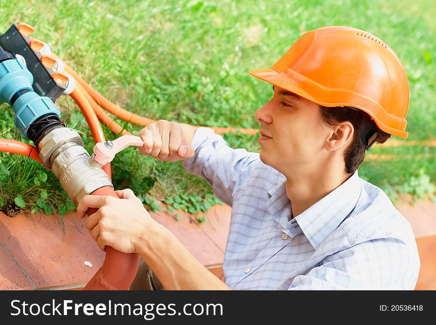 Manual Worker Repairing A Pipe